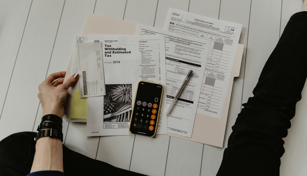 Budget paperwork and calculator — illustrative detail